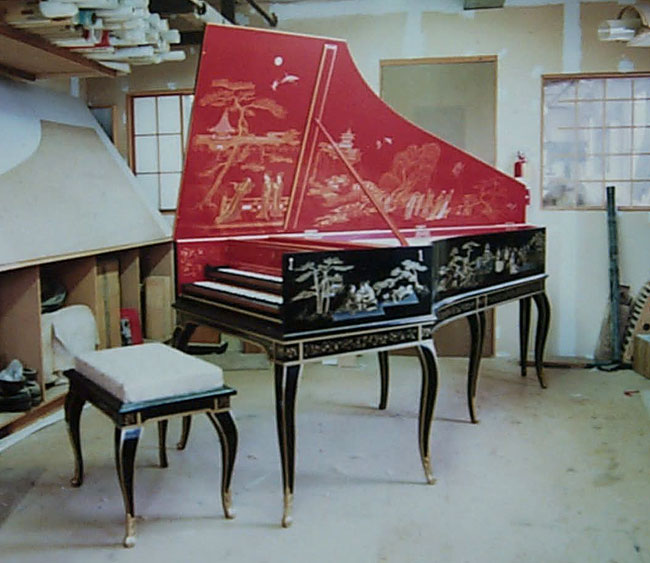 A French double manual is shown decorated with Chinoiserie 