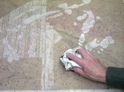 An ink base (asphaltum) is applied - Cariboo Stone Press
