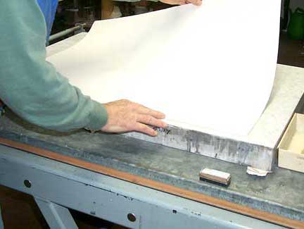 Pressing or 'calandering' editon paper - Cariboo Stone Press